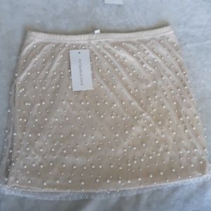 Pearl studded mini skirt